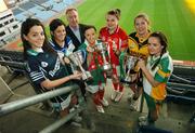 19 November 2007; Team captains, from left, Sinead Goldrick, Foxrock Cabinteely, Maria Kelly, West Clare Gaels, Caroline McGing, Carnacon, Annie Walsh, Inch Rovers, Sile O'Callaghan, Mourneabbey and Kathy Conway, Glen, with Declan Moran, Director of Marketing & Business Development, Vhi Healthcare, at a photocall ahead of the VHI Healthcare All-Ireland Ladies Football Club Championship Finals. The Senior Final between Carnacon of Mayo and Inch Rovers, from Cork, and the Intermediate Final between Mourneabbey, from Cork, and Glen, from Derry, take place this weekend, 25th November, as a double header in St Rynagh's GAA Club, Banagher, Co. Offaly with the Junior Final between West Clare Gaels and Foxrock Cabinteely taking place on Sunday 2nd December. Croke Park, Dublin. Picture credit: Brendan Moran / SPORTSFILE  *** Local Caption ***