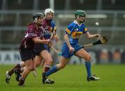 18 November 2007; Sinead Millea, Cashel, Tipperary, in action against Regina Glynn, black helmet, and Sarah Donohue, Athenry, Galway. All-Ireland Senior Camogie Club Championship Final, Athenry, Galway v Cashel, Tipperary, Gaelic Grounds, Co. Limerick. Picture credit: Stephen McCarthy / SPORTSFILE