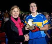 18 November 2007; Philly Fogarty, Cashel, Tipperary, is presented with the player of the match award by Liz Howard, Uachtarán Chumann Camógaíochta na nGael. All-Ireland Senior Camogie Club Championship Final, Athenry, Galway v Cashel, Tipperary, Gaelic Grounds, Co. Limerick. Picture credit: Stephen McCarthy / SPORTSFILE