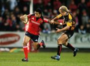 24 November 2007; Lifeimi Mafi, Munster, holds off the tackle of Ashley Smith, Newport Gwent Dragons. Magners League, Munster v Newport Gwent Dragons, Musgrave Park, Cork. Picture credit; Brendan Moran / SPORTSFILE