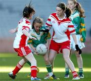 29 November 2007; Niamh Barnes, St. Patrick’s, in action against Lea O'Reilly, left, and Leanne Brophy, St. Dominic’s. Allianz Cumann na mBunscol Corn Uí Shíocháin Final, St. Patrick’s, Ringsend v St. Dominic’s, Tallaght. Croke Park, Dublin. Picture credit; Pat Murphy / SPORTSFILE *** Local Caption ***