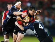 30 November 2007; Ian Dowling, Munster, is tackled by Malcolm O'Kelly, left, and Leo Cullen, Leinster. Magners League, Munster v Leinster, Musgrave Park, Cork. Picture credit: Brendan Moran / SPORTSFILE