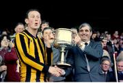 18 April 1982; Kilkenny captain Brian Cody is presented with the National Hurling League trophy by Uachtarán Chumann Lúthchleas Gael Paddy Buggy. 1981/82 National Hurling League Final, Kilkenny v Wexford. Croke Park, Dublin. Picture credit: SPORTSFILE