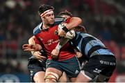 14 February 2015; Billy Holland, Munster, is tackled by Gavin Evans and Rhys Patchell, Cardiff Blues. Guinness PRO12 Round 14, Munster v Cardiff Blues. Irish Independent Park, Cork. Picture credit: Matt Browne / SPORTSFILE