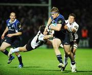 7 December 2007; Jamie Heaslip, Leinster, is tackled by Ross Rennis, left, and David Callam, Edinburgh. Heineken Cup, Pool 6, Round 3, Leinster v Edinburgh, RDS, Ballsbridge, Dublin. Picture credit: Brendan Moran / SPORTSFILE *** Local Caption ***