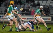 14 February 2015; William Hyland, Laois, is taken down by Offaly's Niall Wynne late in the game. Other Offaly players are Colin Egan, left, Stephen Egan ands Dermot Shortt, right. Allianz Hurling League Division 1B, Round 1, Laois v Offaly. O'Moore Park, Portlaoise, Co. Laois. Picture credit: Ray McManus / SPORTSFILE