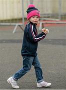 15 February 2015; Deirbhile Mellon, aged 4, from Slaughtneil, Derry, arrives with her hot dog ahead of the game. AIB GAA Football All-Ireland Senior Club Championship, Semi-Final, Austin Stacks v Slaughtneil, O'Moore Park, Portlaoise, Co. Laois. Picture credit: Brendan Moran / SPORTSFILE