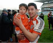 14 February 2015; Tom McGoldrick, Brosna, with his two and half year old son Darragh after the game. AIB GAA Football All-Ireland Junior Club Championship Final, John Mitchel's v Brosna. Croke Park, Dublin. Picture credit: Oliver McVeigh / SPORTSFILE