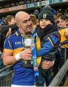 15 February 2015; Gavin Bell, O'Donovan Rossa, and his four year old son Jacob, celebrate with the cup after the game. AIB GAA Hurling All-Ireland Intermediate Club Championship Final, O'Donovan Rossa v Kilburn Gaels, Croke Park, Dublin. Picture credit: Oliver McVeigh / SPORTSFILE