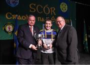 14 February 2015; Ciarán Byrne, J.K. Bracken, Co. Tipperary, is presented with his trophy by Uachtaran Cumann Luthcleas Gael Liam O Neill, left, and Liam O Laochdha, Cathaoirleach, Coiste Naisiunta Scor, right, after winning the Story Telling competition during the All-Ireland Scór na nÓg Championship Finals 2015. Citywest Hotel, Saggart, Co. Dublin. Picture credit: Pat Murphy / SPORTSFILE