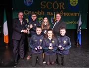 14 February 2015; The Lixnaw, Co. Kerry, team of, from left, Donncha Mac Eileagoid, Neilus O Macasa, Elena Nic Eileagoid, Ciara Ni Sheanain and Dara O Macasa are presented with their trophy by Uachtaran Cumann Luthcleas Gael Liam O Neill, left, and Liam O Laochdha, Cathaoirleach, Coiste Naisiunta Scor, right, after winning the Instrumental Music competition during the All-Ireland Scór na nÓg Championship Finals 2015. Citywest Hotel, Saggart, Co. Dublin. Picture credit: Pat Murphy / SPORTSFILE