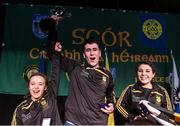 14 February 2015; The The Downs, Co. Westmeath, team members, from left, Niamh Rowan, Paul Lynam and Serena Wynne celebrate with the trophy after winning the Leiriu competition during the All-Ireland Scór na nÓg Championship Finals 2015. Citywest Hotel, Saggart, Co. Dublin. Picture credit: Pat Murphy / SPORTSFILE
