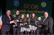 14 February 2015; The Moate All Whites, Co. Westmeath, team, from left, James Rabbitte, Lisa King, Roisin Hamm, Jennifer Coughlan and Oisin Johnston, are presented with their trophy by Uachtaran Cumann Luthcleas Gael Liam O Neill, left, and Liam O Laochdha, Cathaoirleach, Coiste Naisiunta Scor, right, after winning the Ballad Group competition during the All-Ireland Scór na nÓg Championship Finals 2015. Citywest Hotel, Saggart, Co. Dublin. Picture credit: Pat Murphy / SPORTSFILE