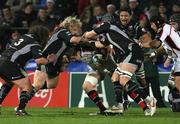 14 December 2007; Ryan Caldwell, Ulster, is tackled by Ian Evans, and Duncan Jones, Ospreys. Heineken Cup, Pool 2, Round 4, Ulster v Ospreys, Ravenhill, Belfast. Picture credit: Oliver McVeigh / SPORTSFILE