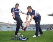 12 December 2007; Cian Ward, DIT, has his shot blocked by Conor Motrimer, DCU, alongside the Sigerson Cup trophy at the 2008 Ulster Bank Sigerson Cup and Fitzgibbon Cup Draws. Croke Park, Dublin. Picture credit: Pat Murphy / SPORTSFILE  *** Local Caption ***