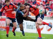16 December 2007; Ian Dowling, Munster, is tackled by Nathan Brew, Llanelli Scarlets. Heineken Cup, Pool 5, Round 4, Munster v Llanelli Scarlets, Thomond Park, Limerick. Picture credit: Matt Browne / SPORTSFILE