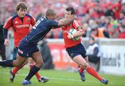 16 December 2007; Ian Dowling, Munster, is tackled by Nathan Brew, Llanelli Scarlets. Heineken Cup, Pool 5, Round 4, Munster v Llanelli Scarlets, Thomond Park, Limerick. Picture credit: Matt Browne / SPORTSFILE *** Local Caption ***