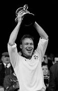 17 March 1990; Brian Fitzpatrick, Baltinglass, lifts the Andy Merrigan Cup after victory over Clann Na nGael. All Ireland Senior Football Club Final, Baltinglass, Co. Wicklow, v Clann Na nGael, Co. Roscommon, Croke Park, Dublin. Picture credit; Ray McManus / SPORTSFILE