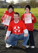 25 December 2007; Niamh O'Brien, 10 years, and her 8 year old brother Cathal, from Ennis, Co Clare with former Clare hurler James O'Connor after 'competing' in one of the many Goal Miles taking place nationwide. Annual Goal Mile, Fairgreen, Ennis, Co Clare. Picture credit: Ray McManus / SPORTSFILE