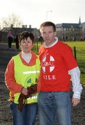 25 December 2007; Organiser Mary Collins with former Clare hurler James O'Connor after 'competing' in one of the many Goal Miles taking place nationwide. Annual Goal Mile, Fairgreen, Ennis, Co Clare. Picture credit: Ray McManus / SPORTSFILE