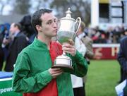 27 December 2007; Jockey Ross Geraghty celebrates with the Paddy Power Steeplechase Cup after winning with Newbay Prop. Leopardstown Racecourse, Leopardstown, Dublin. Picture credit: Matt Browne / SPORTSFILE