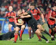 27 December 2007; Paul Warwick, Munster, is tackled by Johnny O'Connor, Connacht. Magners League, Munster v Connacht, Musgrave Park, Cork. Picture credit; Brendan Moran / SPORTSFILE