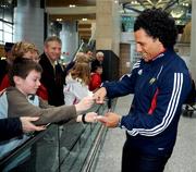 28 December 2007; Munster's new signing and New Zealand international Doug Howlett signs an autograph for young fan Mark Sheahan, from Cork, on his arrival at Cork Airport before starting the next stage of his rugby career with Munster. Cork Airport, Cork. Picture credit; Brendan Moran / SPORTSFILE *** Local Caption ***