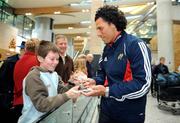 28 December 2007; Munster's new signing and New Zealand international Doug Howlett signs an autograph for young fan Mark Sheahan, from Cork, on his arrival at Cork Airport before starting the next stage of his rugby career with Munster. Cork Airport, Cork. Picture credit; Brendan Moran / SPORTSFILE *** Local Caption ***