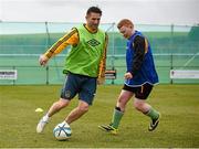 19 February 2015; LA Galaxy striker Robbie Keane turned a training session into a field of dreams for Special Olympics Ireland footballers yesterday. The Irish football captain, who is in town to face Shamrock Rovers this weekend, invited the athletes to a skills session where they got to meet several of the LA Galaxy players. This is the second time Keane has trained with the athletes. The soccer legend and his wife Claudine are supporting the 88 Irish athletes heading to the 2015 Special Olympics World Games in Los Angeles. He is urging the country to get behind them and help raise the €440,000 target to fund the trip. Full details of Special Olympics Ireland Support An Athlete campaign can be found at www.specialolympics.ie. Pictured during the training session are LA Galaxy's Robbie Keane and Peter Fitzpatrick, Special Olypmics 5 A Side. Picture credit: Pat Murphy / SPORTSFILE