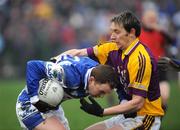 6 January 2008; Brian McCormack, Laois, in action against John Hudson, Wexford. O'Byrne Cup, First Round, Wexford v Laois, Belfield, Enniscorthy, Co. Wexford. Picture credit; Matt Browne / SPORTSFILE