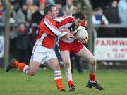 6 January 2008; Enda Muldoon, Derry, in action against Enda McNulty, Armagh. Gaelic Life, Dr. McKenna Cup, Section A, Armagh v Derry, Davitt Park, Lurgan, Co. Armagh. Picture credit; Oliver McVeigh / SPORTSFILE