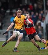 21 February 2015; Conor McGraynor, DCU, kicks the winning point in the second half of extra time despite pressure from Jamie Davis, UCC. Independent.ie Sigerson Cup Final, UCC v DCU. The Mardyke, Cork. Picture credit: Diarmuid Greene / SPORTSFILE