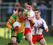 13 January 2008; Colm McFadden, Donegal, in action against Colin Holmes and Philip Jordan, Tyrone. Gaelic Life, Dr. McKenna Cup, Section B, Donegal v Tyrone, Fr Tierney Park, Ballyshannon, Co. Donegal. Picture credit; Oliver McVeigh / SPORTSFILE