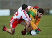 13 January 2008; Johnny McLoone, Donegal, in action against PJ Quinn, Tyrone. Gaelic Life, Dr. McKenna Cup, Section B, Donegal v Tyrone, Fr Tierney Park, Ballyshannon, Co. Donegal. Picture credit; Oliver McVeigh / SPORTSFILE