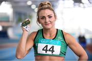22 February 2015; Kelly Proper, Ferrybank AC, with her 3 gold medals, after winning the Long Jump, 60m and 200m, at Day 2 of the GloHealth Senior Indoor Championships. Athlone International Arena, Athlone, Co. Westmeath. Picture credit: Pat Murphy / SPORTSFILE