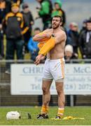 22 February 2015; Neil McManus, Antrim, changing shirts during the first half. Allianz Hurling League, Division 1B, Round 2, Antrim v Limerick, Ballycastle, Co. Antrim. Picture credit: Oliver McVeigh / SPORTSFILE
