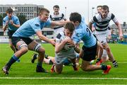 23 February 2015; Dave Hawkshaw, Belvedere College, goes over for his side's second try, despite the tackles of Jody Booth, left, and Tony Doyle, right, St. Michael's College. Bank of Ireland Leinster Schools Junior Cup, in association with Beauchamps Solicitors, Quarter-Final, St Michael's College v Belvedere College. Donnybrook Stadium, Donnybrook, Dublin. Picture credit: Cody Glenn / SPORTSFILE