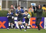 12 January 2008; Leinster captain Brian O'Driscoll runs out onto the pitch with the team mascots followed by a TV cameraman. Heineken Cup, Pool 6, Round 5, Leinster v Toulouse, RDS, Dublin. Picture credit; Brendan Moran / SPORTSFILE *** Local Caption ***