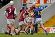 22 February 2015; Séamus Callanan, Tipperary, tangles with Galway players, from left, Johnny Coen, 2, David Colins and Gearóid McInerney, after fouling Pádraig Mannion, bottom. Allianz Hurling League, Division 1A, Round 2, Tipperary v Galway. Semple Stadium, Thurles, Co. Tipperary. Picture credit: Piaras Ó Mídheach / SPORTSFILE