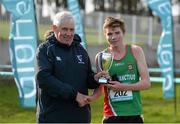 24 February 2015; PJ Leddy, winner of the Senior Boy's title 50 years ago, presents the cup to Senior Boy's race winner Jamie Fallon, from Calasanctius College, Oranmore, at the GloHealth Connacht Schools Cross Country Championships. Sligo Race Course, Sligo. Picture credit: Oliver McVeigh / SPORTSFILE