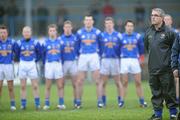 20 January 2008; Longford manager Luke Dempsey stands with the Longford players during the playing of the national anthem before the start of the game. O'Byrne Cup Semi-Final, Longford v DCU, Pearse Park, Longford. Picture credit; David Maher / SPORTSFILE