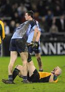 22 January 2008; Referee Sean Carroll receives treatment from Dublin's Éamon Fennell. O'Byrne Cup Semi-Final, Dublin v Carlow, Parnell Park, Dublin. Picture credit; Pat Murphy / SPORTSFILE *** Local Caption ***