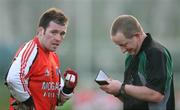 6 January 2008; Armagh's Ciaran McKeever receives a booking from referee Con Reynolds. Gaelic Life, Dr. McKenna Cup, Section A, Armagh v Derry, Davitt Park, Lurgan, Co. Armagh. Picture credit; Oliver McVeigh / SPORTSFILE