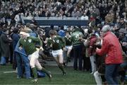 20 February 1982; Gerry &quot;Ginger&quot; McLoughlin, Ireland, left, runs onto the pitch followed by Hugo MacNeill. Ireland v Scotland. Lansdowne Road. Ireland 21 Scotland 12. Picture credit: SPORTSFILE