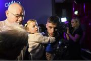 27 February 2015; Carl Frampton with daughter Carla after weighing in for the defence of his IBF Super-bantamweight World Title against Chris Avalos. Europa Hotel, Belfast, Co. Antrim. Picture credit: Ramsey Cardy / SPORTSFILE