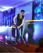 27 February 2015; Staff member Ben Murphy, from Belturbet, cleans the stage area before the GAA Annual Congress 2015. Slieve Russell Hotel, Cavan. Picture credit: Ray McManus / SPORTSFILE