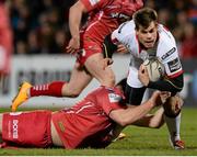 27 February 2015; Louis Lukik, Ulster, is tackled by Jordan Williams, Scarlets. Guinness PRO12 Round 16, Ulster v Scarlets. Kingspan Stadium, Ravenhill Park, Belfast. Picture credit: Oliver McVeigh / SPORTSFILE