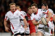 27 February 2015; Darren Cave, Ulster, bursts throught the Scarlets defence. Guinness PRO12 Round 16, Ulster v Scarlets. Kingspan Stadium, Ravenhill Park, Belfast. Picture credit: Oliver McVeigh / SPORTSFILE