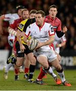 27 February 2015; Darren Cave, Ulster, bursts through the Scarlets defence. Guinness PRO12 Round 16, Ulster v Scarlets. Kingspan Stadium, Ravenhill Park, Belfast. Picture credit: Oliver McVeigh / SPORTSFILE