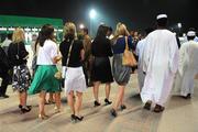 24 January 2008; Members of the Ladies All-Star football teams make their way through the main enclosure during the evening's racing. O'Neills/TG4 Ladies Gaelic Football All Star Tour 2007, Nad Al Sheba Racecourse, Dubai, United Arab Emirates. Picture credit: Brendan Moran / SPORTSFILE  *** Local Caption ***